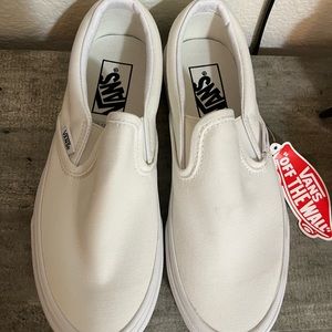 White slip on Vans